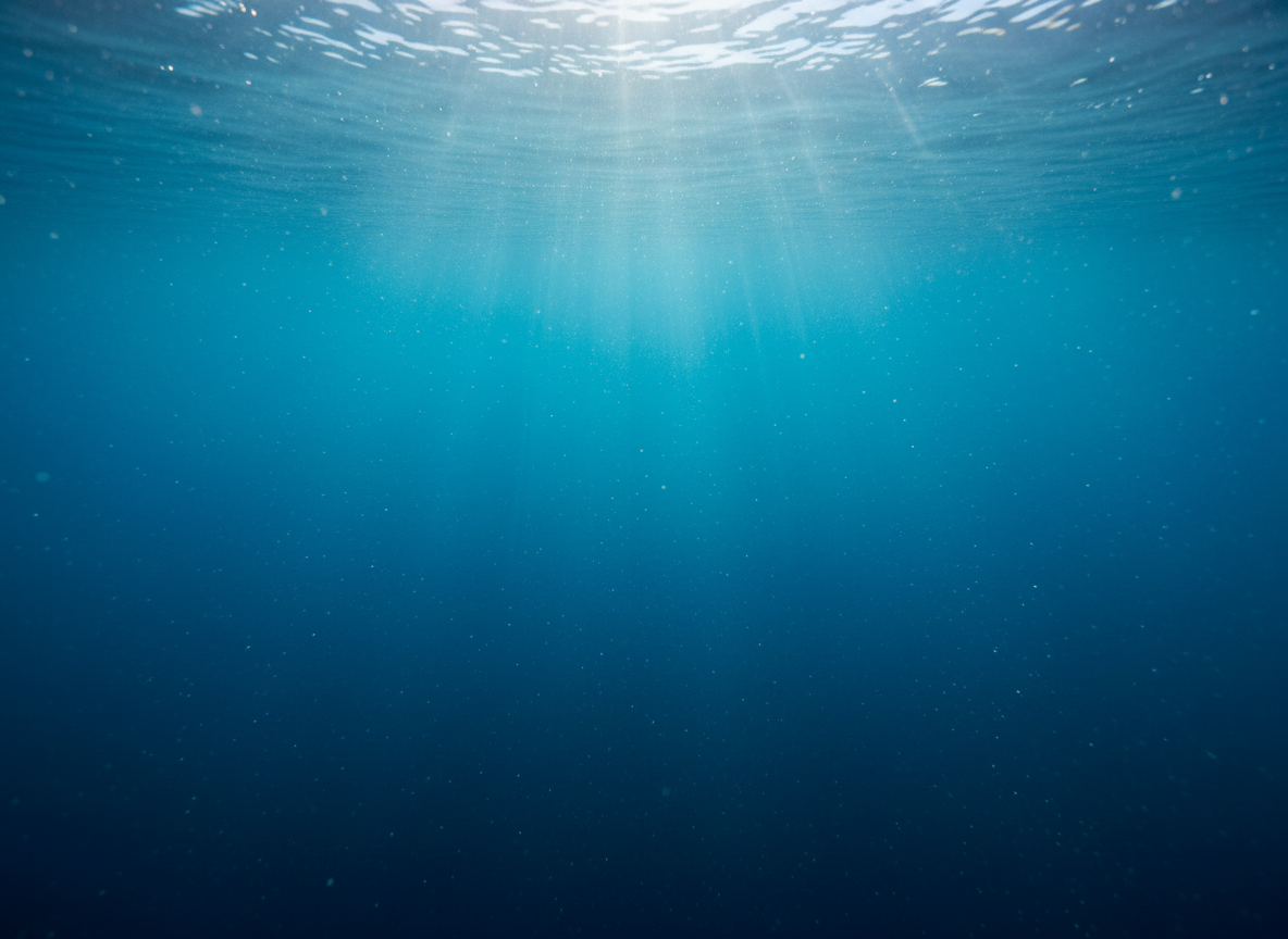 Sunlight filtering through deep blue ocean water